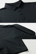 The TECHTEE black polo shirt with collar and buttons on a white background