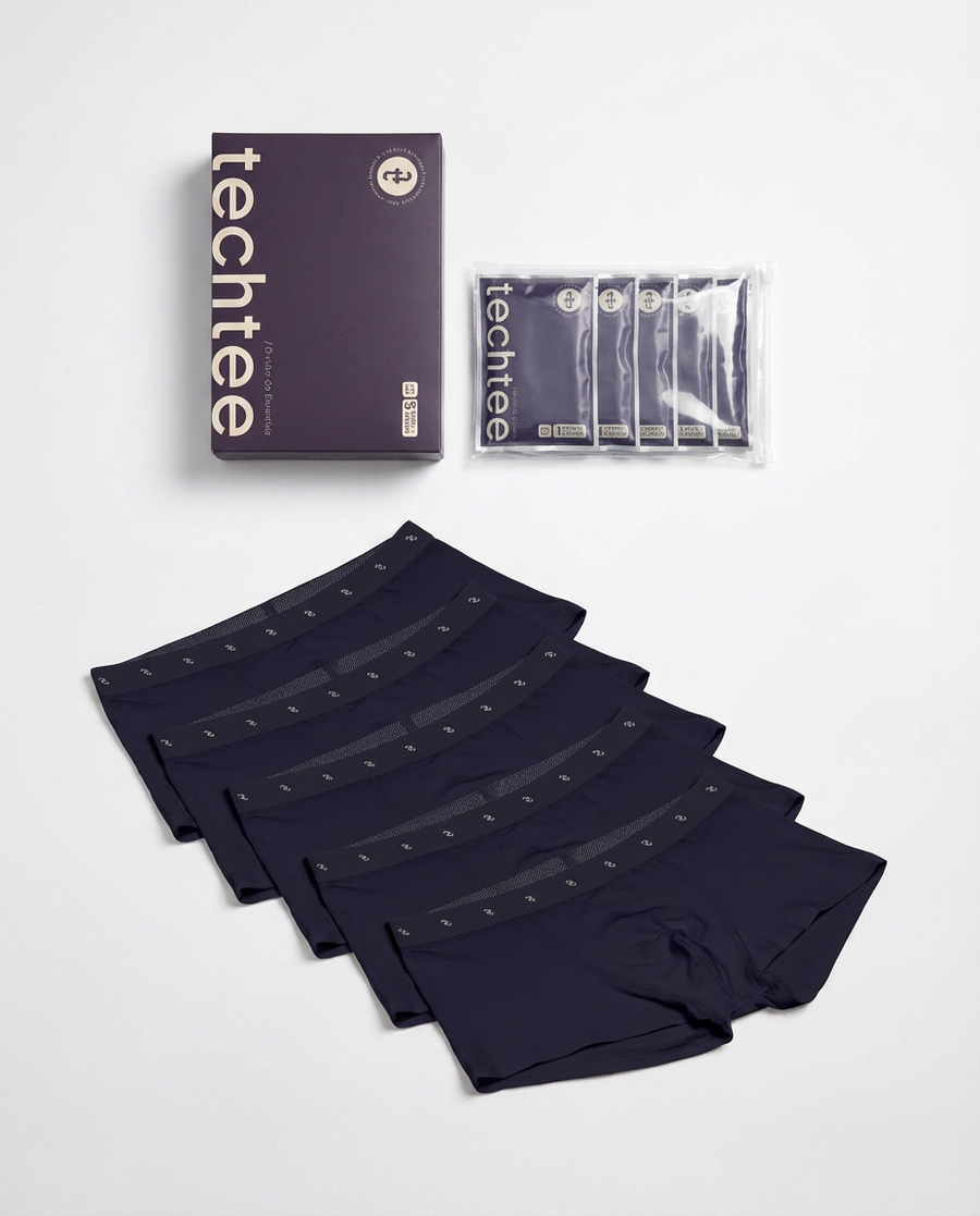 Set of navy blue boxer briefs with packaging on a white background