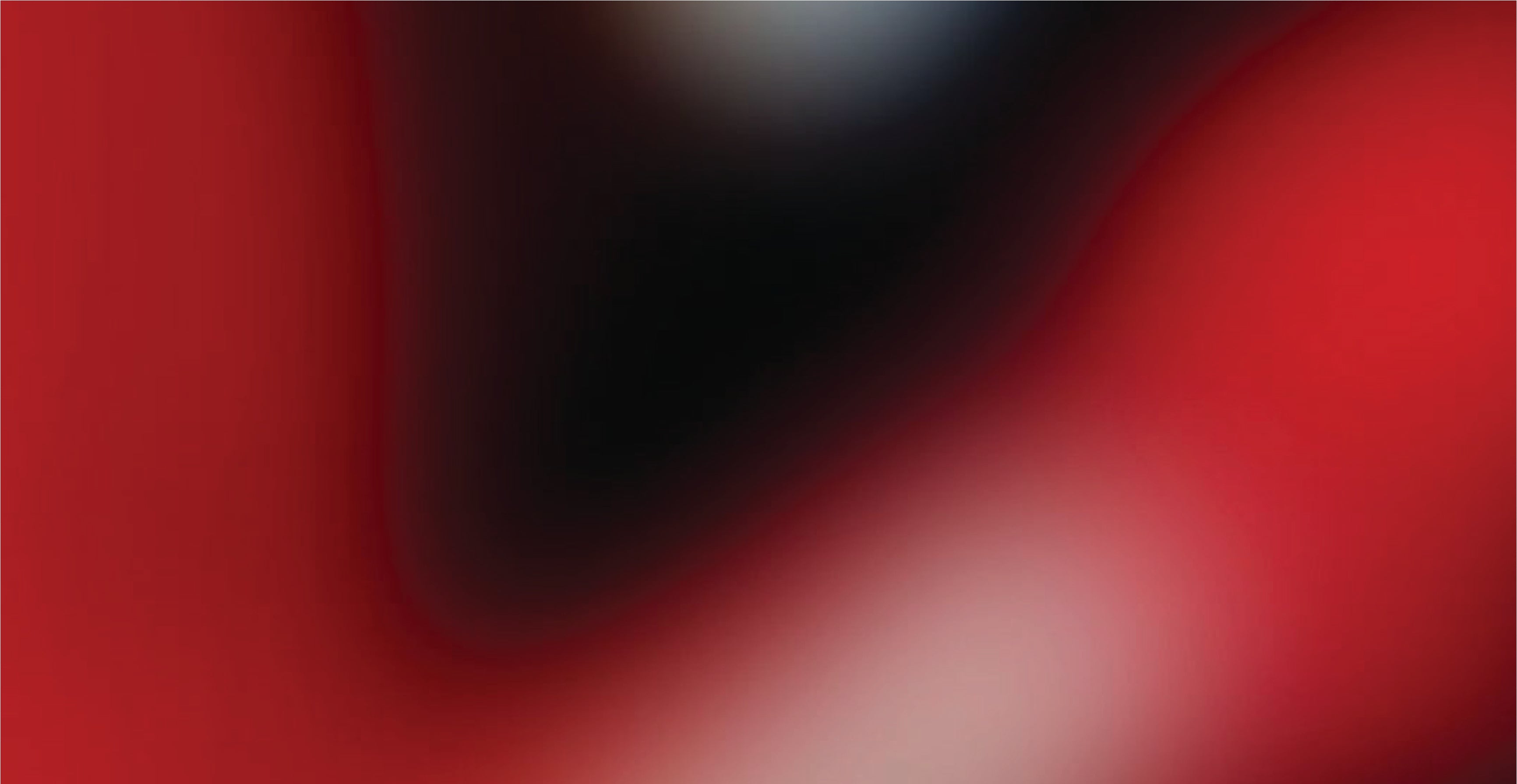 Abstract gradient background transitioning from red to black